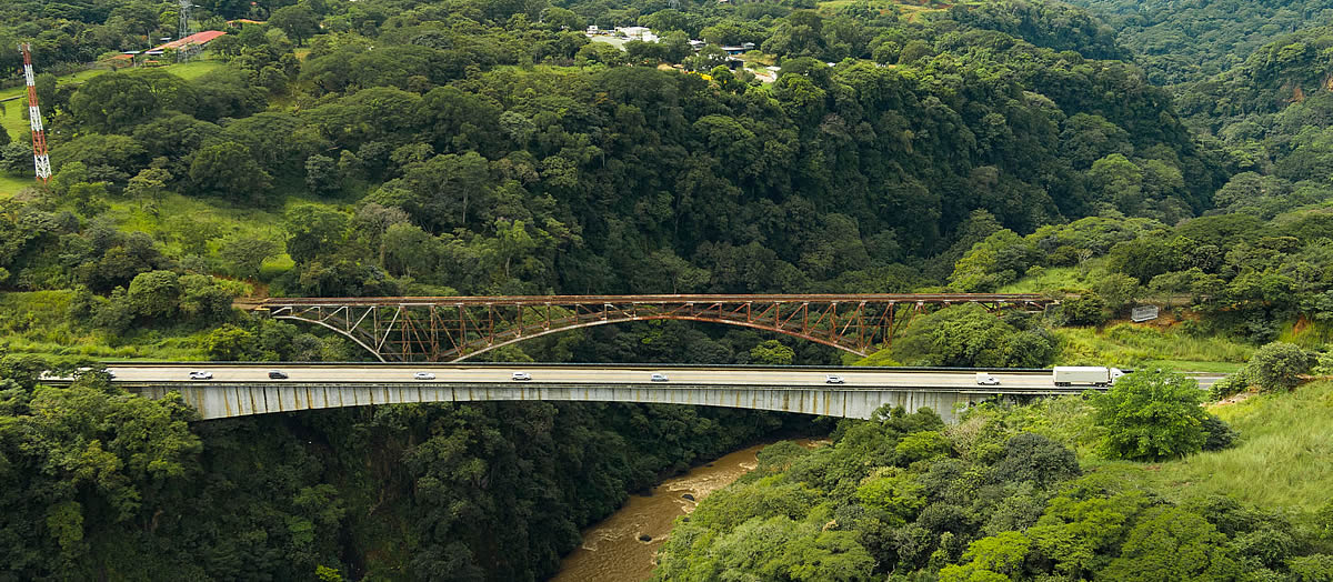 Costa Rica Global Development, bridges over a river in the green, mountainous valley of Concepción, Costa Rica