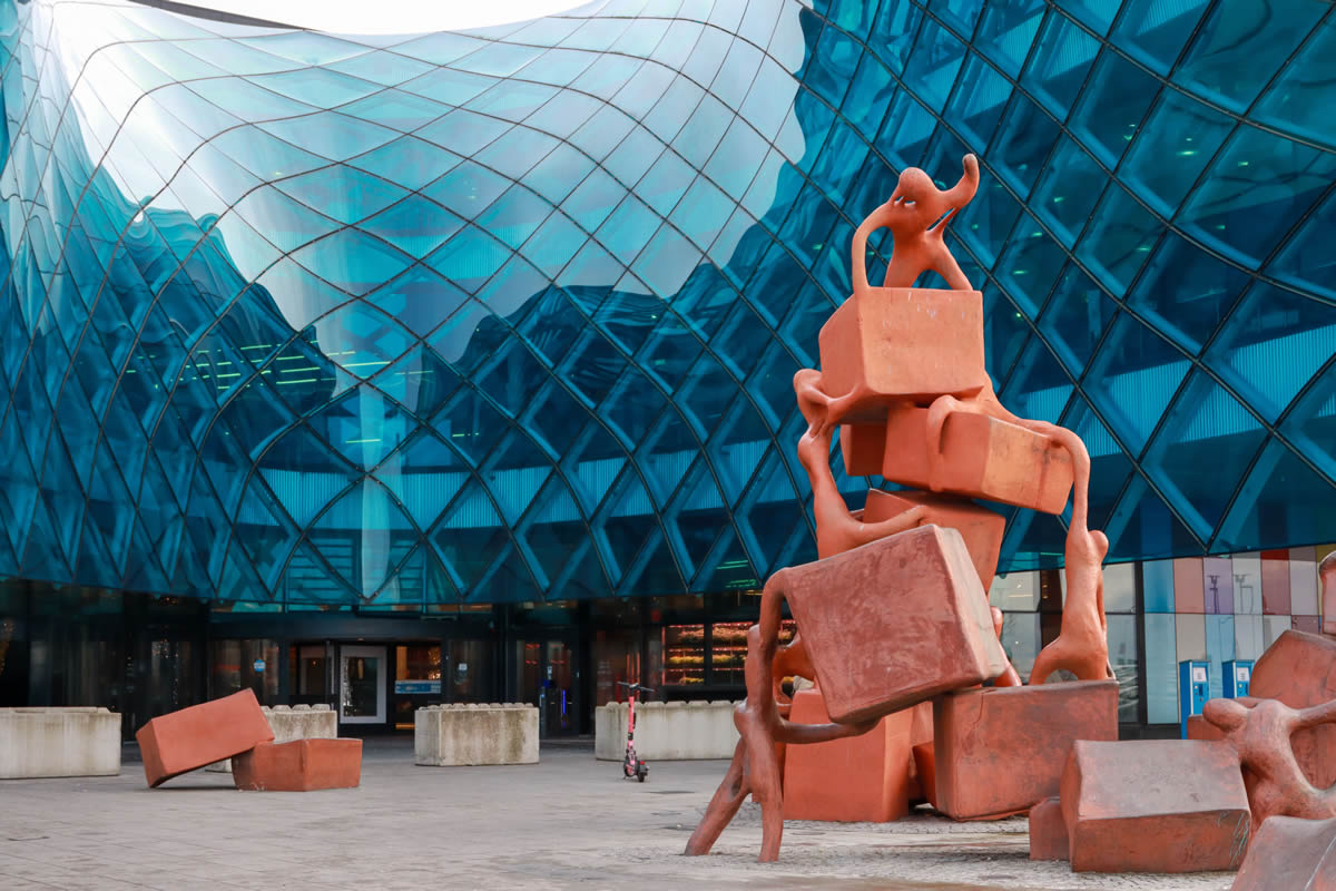Creative Cities for Culture of Peace, sculpture and glass architecture facade in Malmö, Sweden