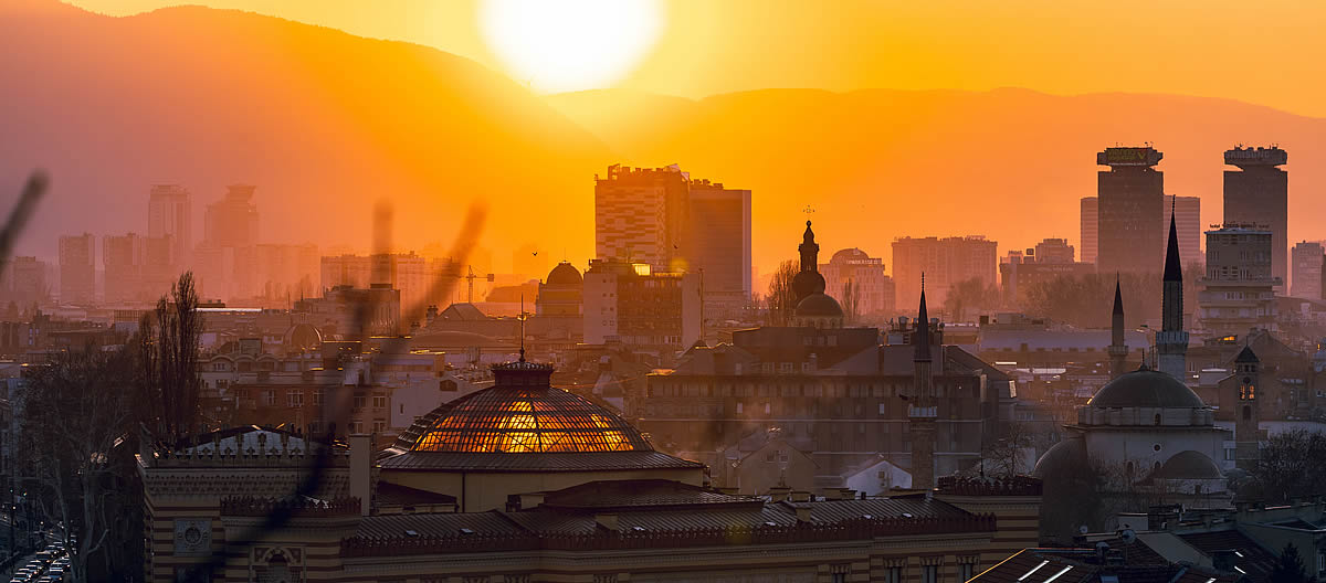 Culture Women's Day Bosnia and Herzegovina, sunset over Sarajevo with vibrant cityscape and mountain backdrop