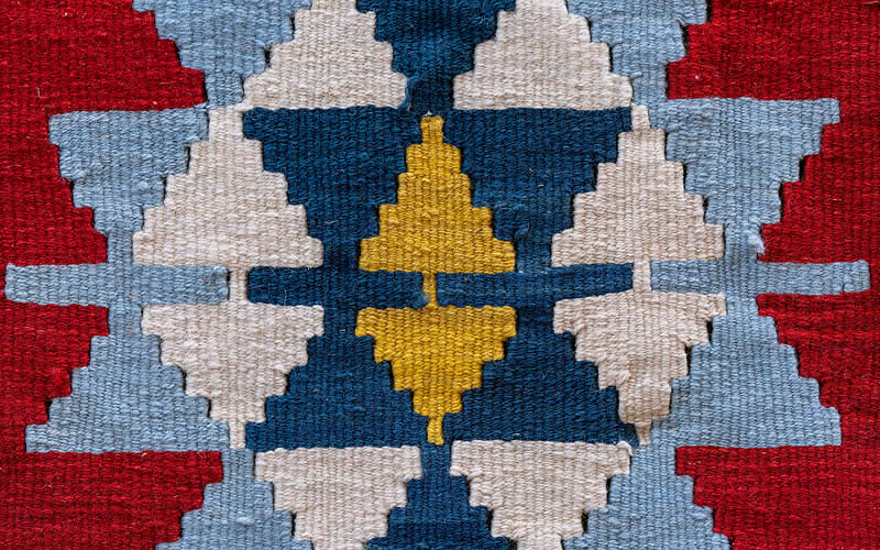 Cosmology of Peace, Research Methodology, carpet in primary colours symbolizing the ancient red, yellow, blue silk road.