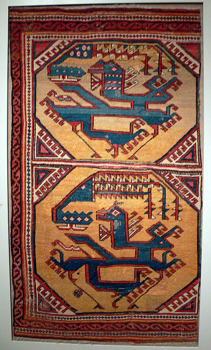 Silk Road in Anatolia, the 15th-century Anatolian Dragon and Phoenix carpet from the Pergamon Museum, showing geometric animals on a yellow ochre medallion ground.