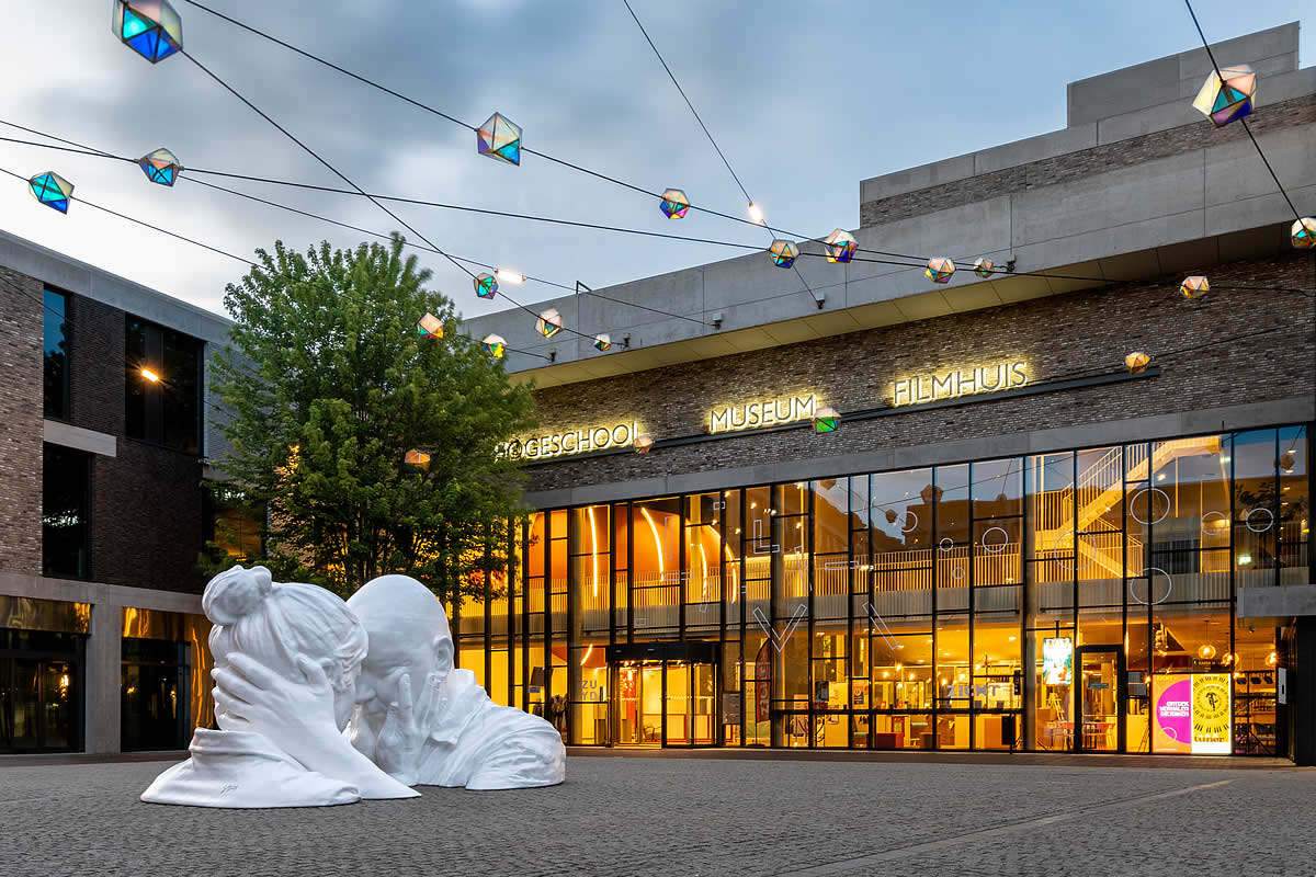 The Cosmology of Peace Exhibition, museum garden with modern sculpture and festive lights