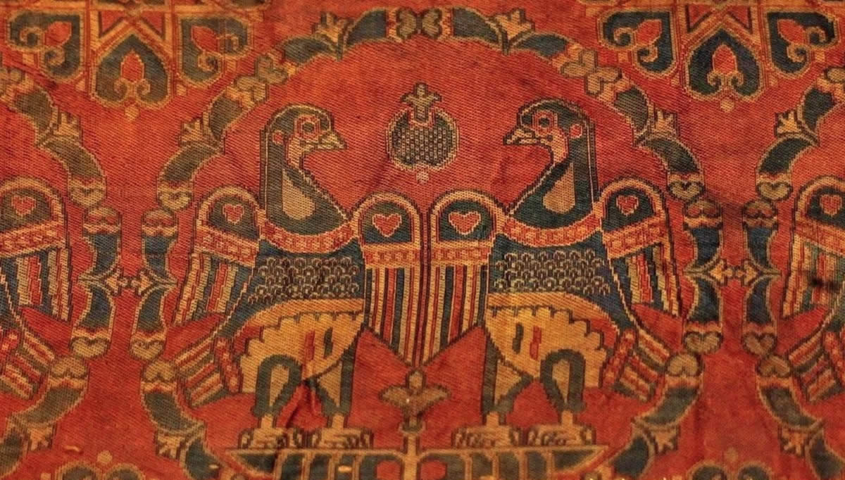 Silk Road in China. Sichuan brocade with double-bird-within-floral-roundel pattern, displaying strong Central Asian influence. Collection of Chengdu Museum. Date between 618 and 907.