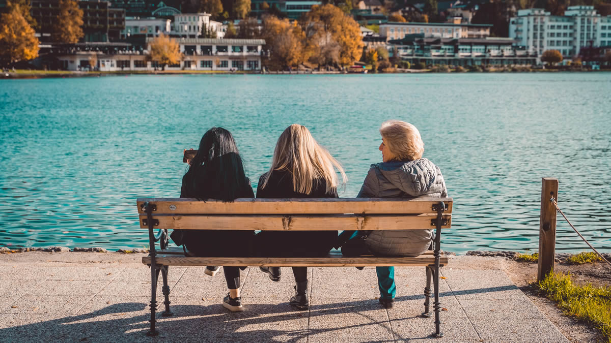 Women’s Right to Vote Slovenia Culture Women's Day, women on bench at lake Lesce, Radovljica